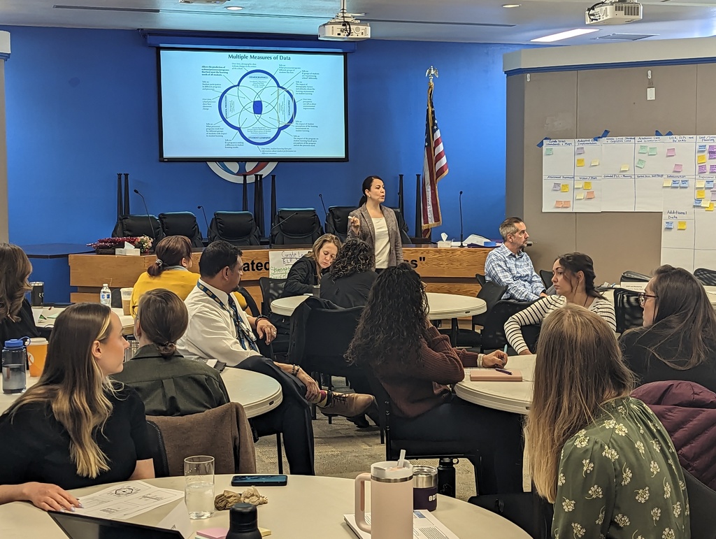 staff engaging in a leadership training meeting