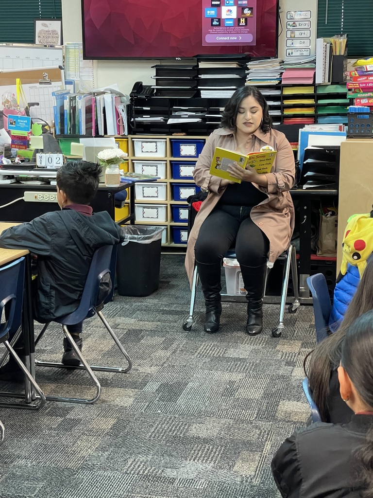 A parent reading to Ms. Rocha's class.